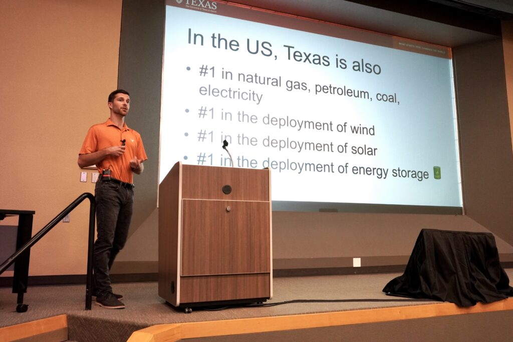 Dr. Drew Kassel of Webber Energy Group presenting on stage to the Study Mission 6.0 Delegation at the University of Texas at Austin. 