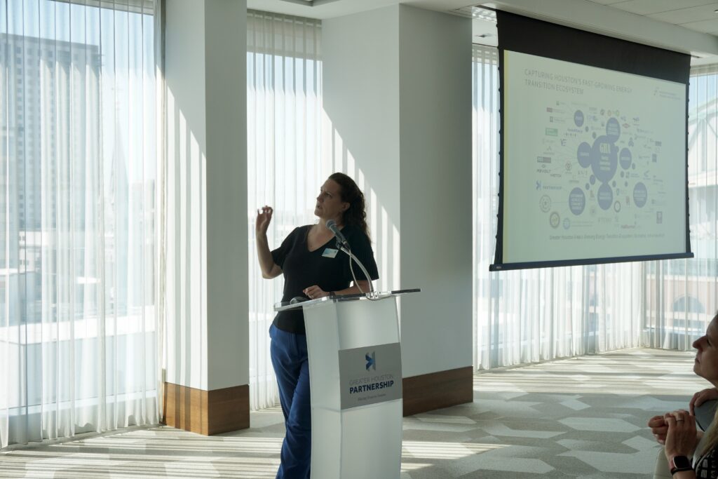 Kera Gautreau, Senior Director, Houston Energy Transition Initiative (HETI) presenting at podium to Study Mission 6.0 delegation. 